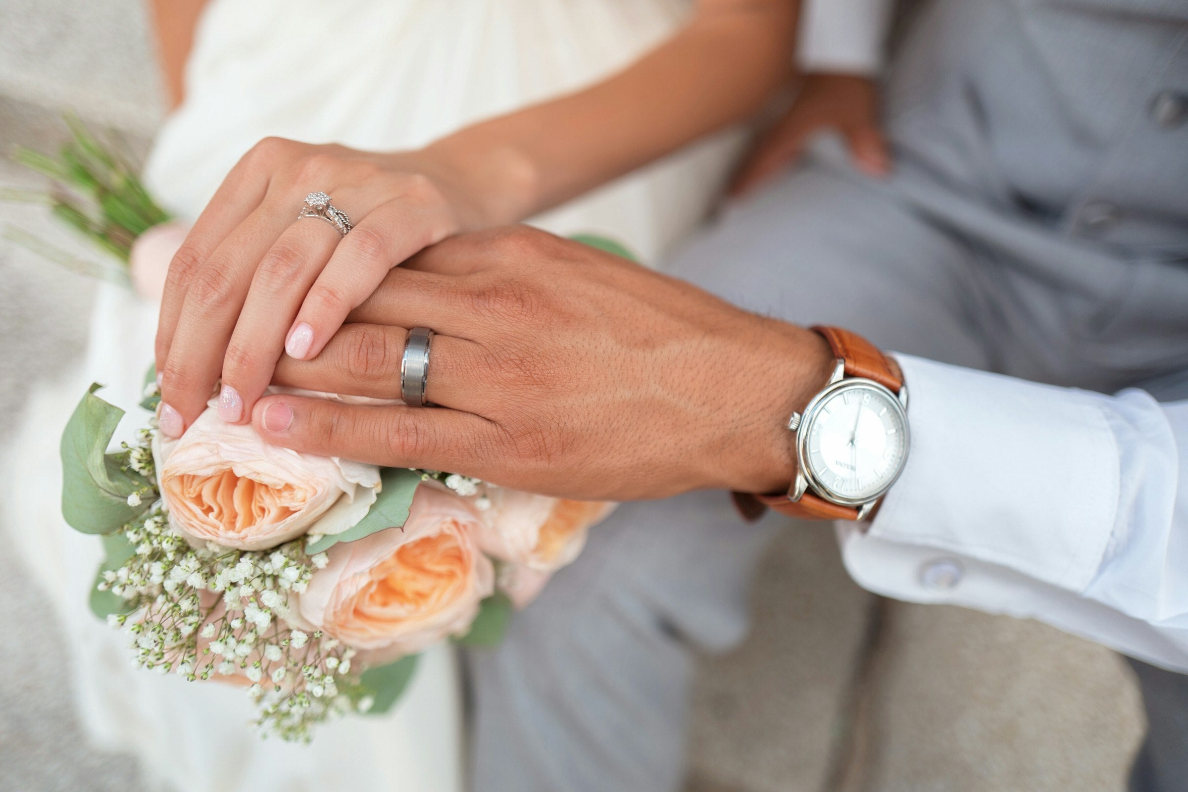 Luxury Wedding Studio hero - wedding rings and florals
